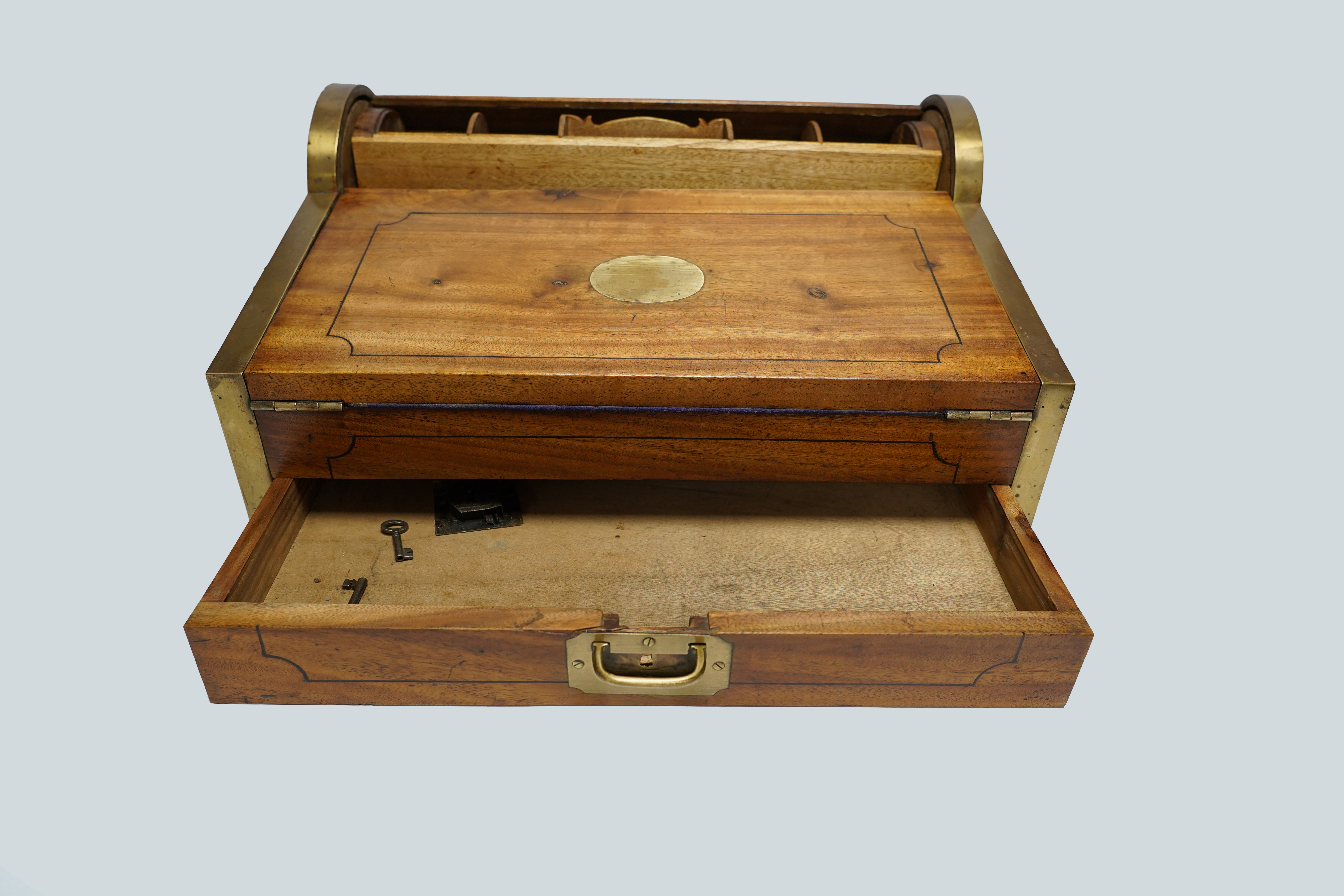 A 19th/20th century Anglo-Indian brass bound camphorwood roll top writing box, 47.5cm wide